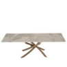 Tavolo Pegaso Pietra Patagonia con gambe bronzo design moderno